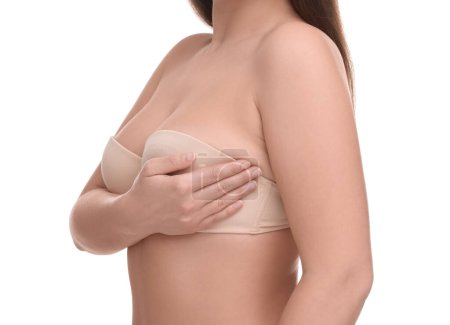 Mammology. Woman in bra doing breast self-examination on white background, closeup