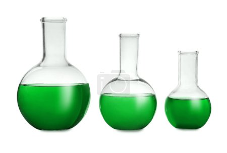 Photo for Boiling flasks with green liquid isolated on white. Laboratory glassware - Royalty Free Image