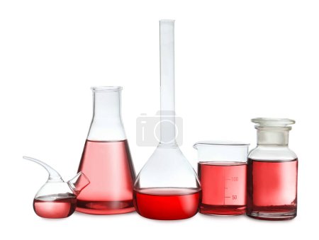 Laboratory glassware with red liquid isolated on white