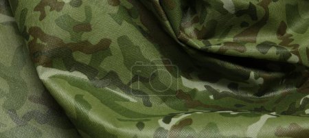 Texture of crumpled camouflage fabric as background, top view