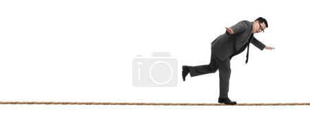 Photo for Risks and challenges of owning business. Man balancing on rope against white background, banner design - Royalty Free Image