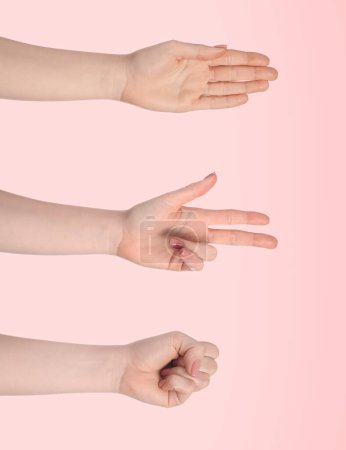 Photo for People playing rock, paper and scissors on pink background, closeup - Royalty Free Image