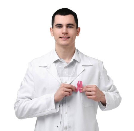 Portrait of smiling mammologist with pink ribbon on white background. Breast cancer awareness