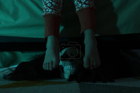 Photo for Childhood phobia. Girl and scary monster under bed at home, closeup - Royalty Free Image