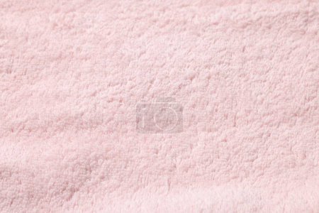Textur aus weichem rosa Stoff als Hintergrund, Draufsicht