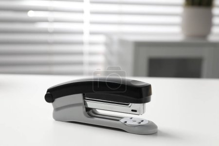 One stapler on white table indoors, closeup