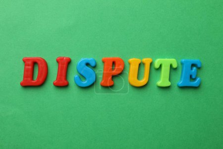 Photo for Word Dispute made of colorful letters on green background, flat lay - Royalty Free Image