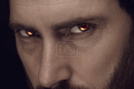 Man with fire burning in his eyes, closeup. Evil eye
