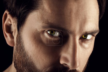 Captivating gaze. Man with green eyes, closeup