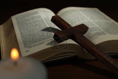 Photo for Cross, Bible and church candle on wooden table - Royalty Free Image