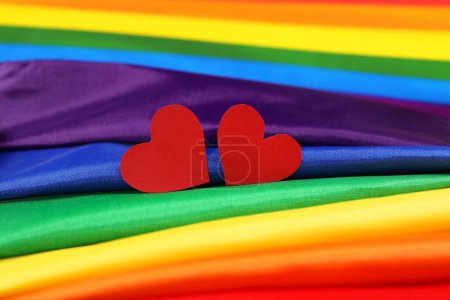 Hearts on rainbow LGBT flag, closeup view