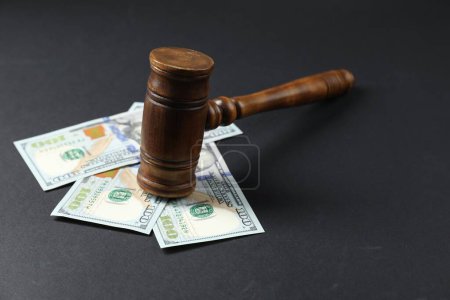 Photo for Law gavel with dollars on grey table - Royalty Free Image