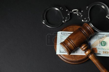 Photo for Law gavel, dollars and handcuffs on grey table, flat lay. Space for text - Royalty Free Image