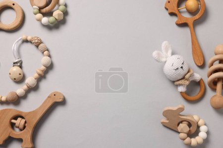 Different baby accessories on grey background, flat lay. Space for text