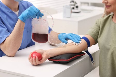 Patient undergoing blood transfusion in hospital, closeup