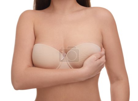 Mammology. Woman in bra doing breast self-examination on white background, closeup