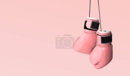 Lutte contre le cancer du sein. Paire de gants de boxe roses sur fond de couleur, espace pour le texte. Conception de bannière