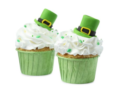 St. Patrick's day party. Tasty cupcakes with green leprechaun hat toppers and sprinkles isolated on white