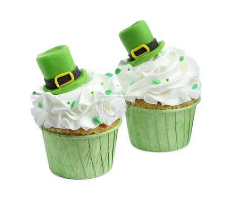 St. Patrick's day party. Tasty cupcakes with green leprechaun hat toppers and sprinkles isolated on white