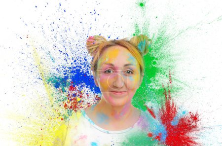 Holi festival celebration. Woman covered with colorful powder dyes on white background