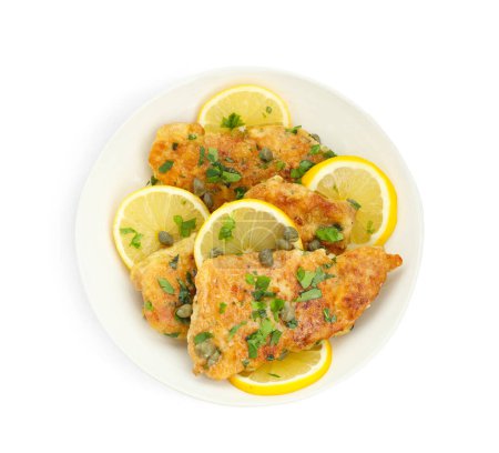 Delicious chicken piccata with herbs isolated on white, top view