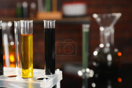 Laboratory glassware with different types of oil, closeup
