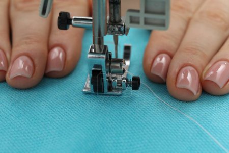Photo for Seamstress working with sewing machine, selective focus - Royalty Free Image