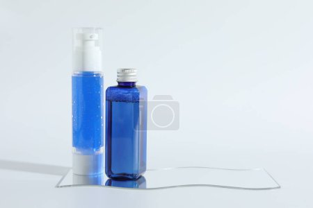 Photo for Different containers with cosmetic products on light background, space for text - Royalty Free Image