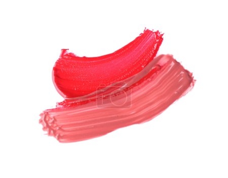 Foto de Trazos de brillo de labios de color aislados en blanco, vista superior - Imagen libre de derechos