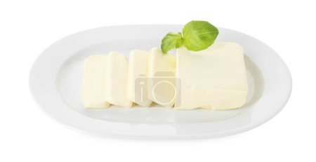 Dish with tasty cut butter isolated on white, above view