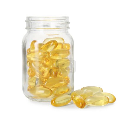 Bottle and pile of softgel capsules isolated on white