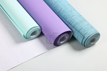 Photo for Different stylish wallpaper rolls on light background - Royalty Free Image