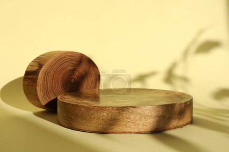 Photo for Presentation of product. Wooden podiums on yellow background. Space for text - Royalty Free Image