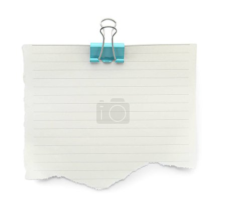 Photo for Piece of lined notebook sheet with binder clip isolated on white, top view - Royalty Free Image