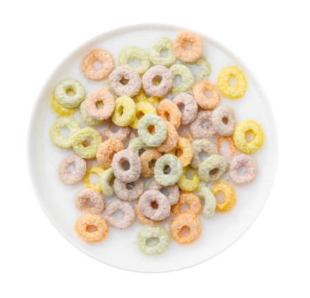 Photo for Tasty colorful cereal rings and milk in bowl isolated on white, top view - Royalty Free Image