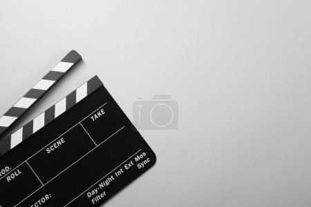 Clapperboard on gray background, top view. Space for text