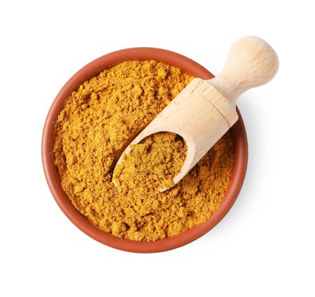 Curry powder in bowl and scoop isolated on white, top view