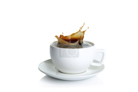Coffee splashing in cup on white background