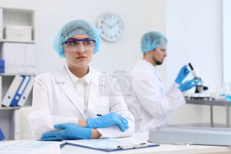 Photo for Quality control. Food inspectors checking safety of products in laboratory - Royalty Free Image