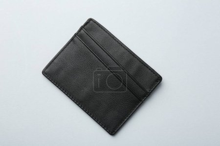 Empty leather card holder on light grey background, top view