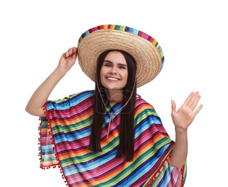 Téléchargez les photos : Jeune femme en chapeau de sombrero mexicain et poncho saluant sur fond blanc - en image libre de droit