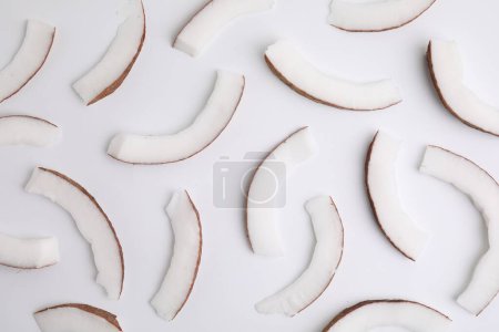 Photo for Pieces of fresh coconut on white background, top view - Royalty Free Image