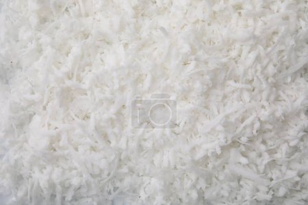 Photo for Fresh coconut flakes as background, top view - Royalty Free Image