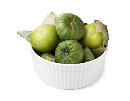 Bowl of fresh green tomatillos with husk isolated on white