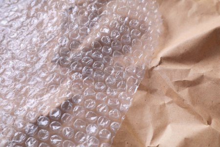 Transparent bubble wrap on kraft paper, closeup