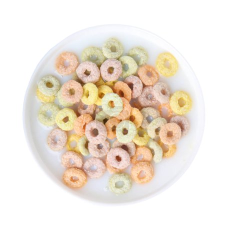 Photo for Tasty colorful cereal rings and milk in bowl isolated on white, top view - Royalty Free Image