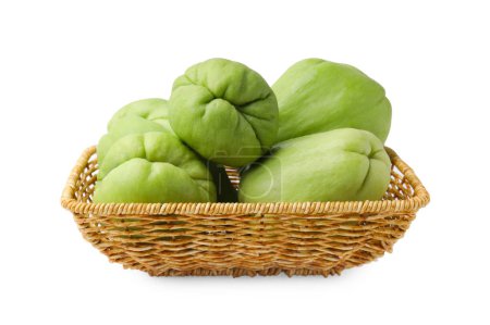 Photo for Fresh green chayote in wicker basket isolated on white - Royalty Free Image
