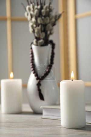 Photo for Burning candle on wooden table, closeup. Space for text - Royalty Free Image