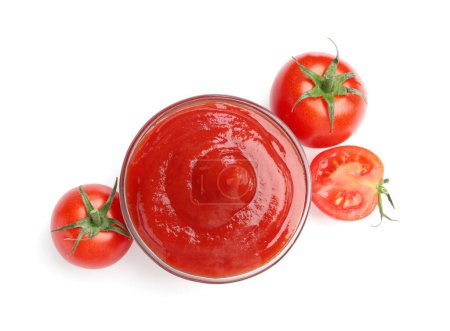 Photo for Tasty ketchup in glass bowl and fresh tomatoes isolated on white, top view - Royalty Free Image