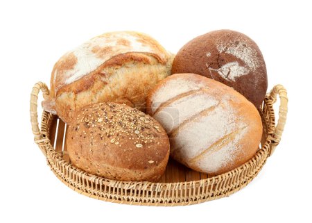 Wicker basket with different types of fresh bread isolated on white